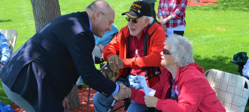 Congressman Stauber shaking hands with a woman