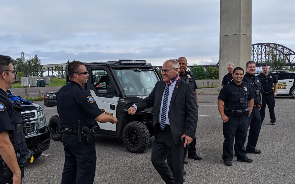 Rep. Stauber fist bumps a police officer