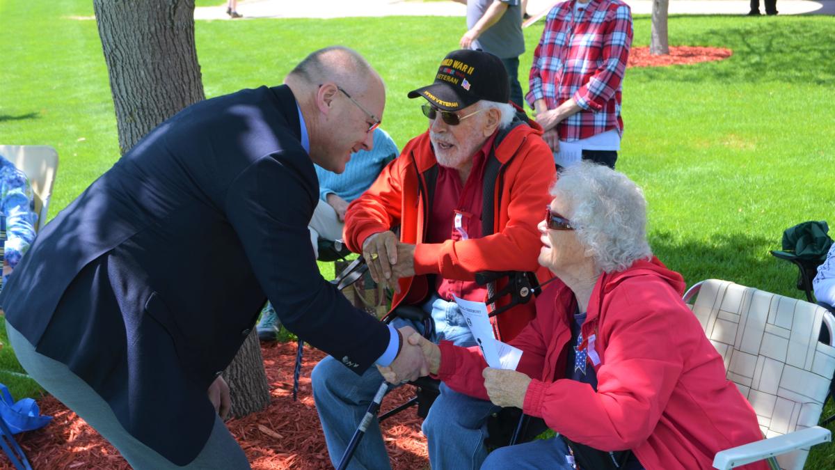 Congressman Stauber shaking hands with a woman